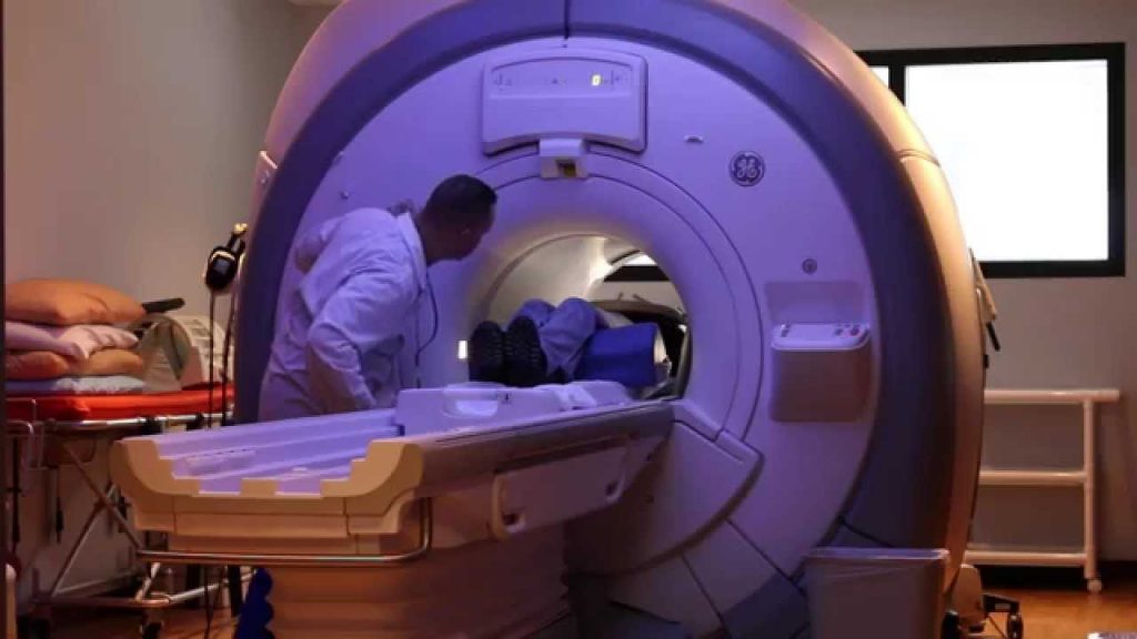 Technologist with a patient in the wide-bore 1.5T MRI scanner used for MRI-guided breast biopsy at Greater Waterbury Imaging Center